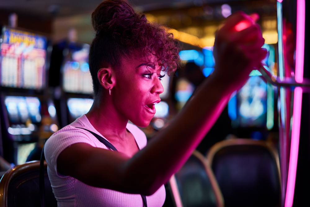 Woman playing slot machine